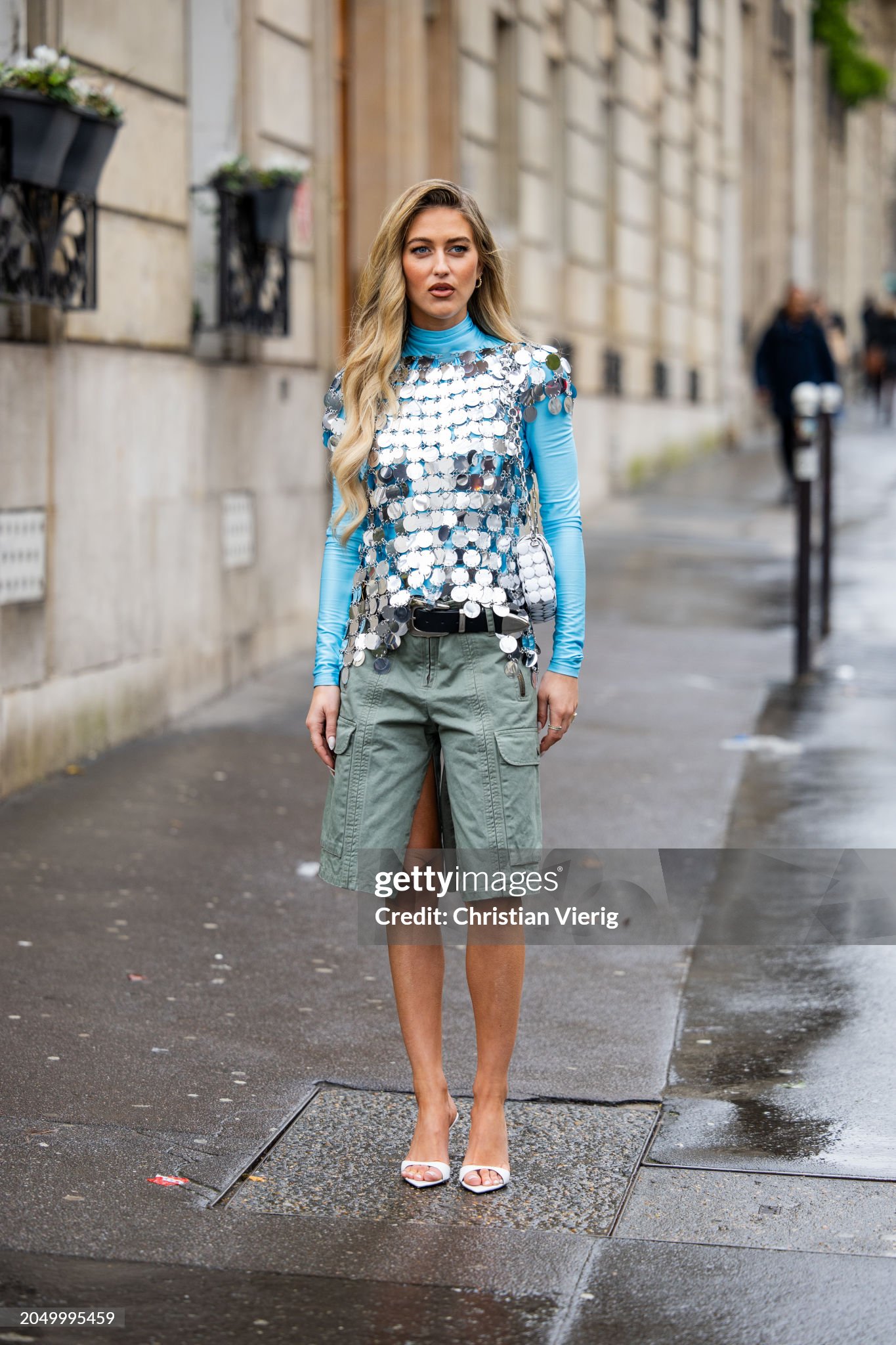 paris-france-emili-sindlev-wears-green-shorts-with-side-pockets-silver-top-blue-long-shirt.jpg