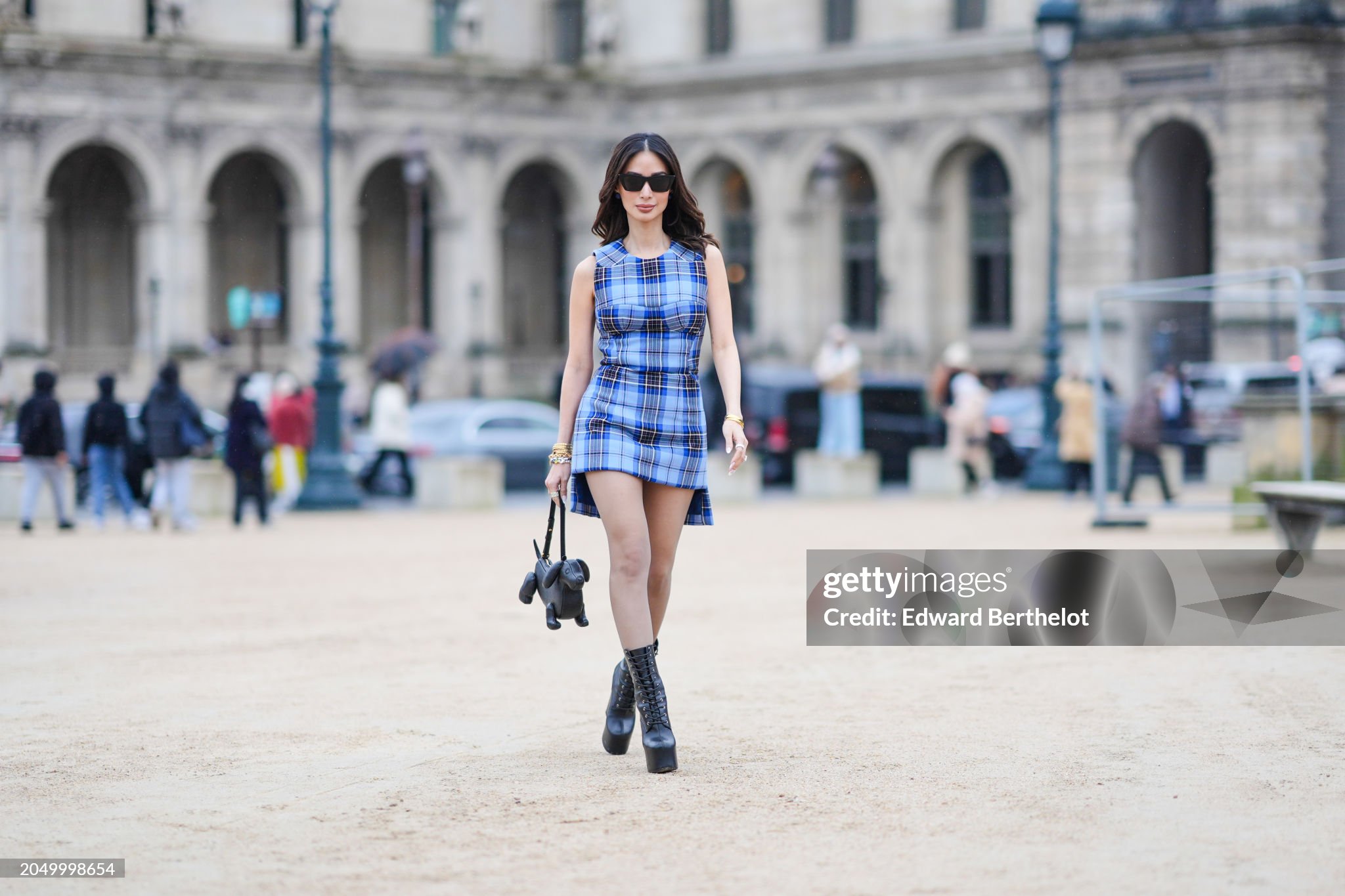 paris-france-heart-evangelista-wears-sunglasses-a-sleeveless-blue-and-black-checkered-checked.jpg