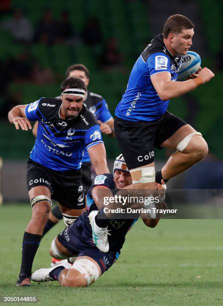 Josh Canham of the Rebels tackles Will Harris of the Western Force during the round two Super Rugby Pacific match between Melbourne Rebels and...