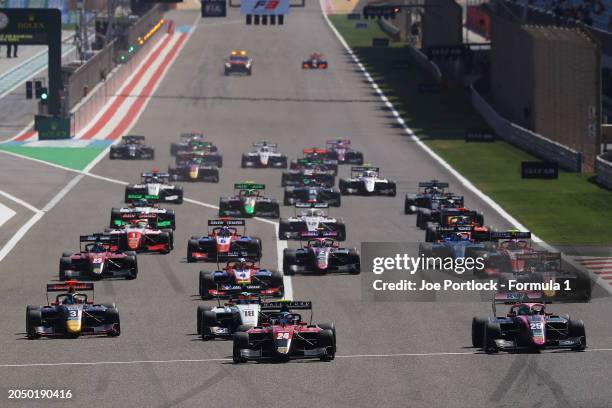 Laurens van Hoepen of Netherlands and ART Grand Prix leads Nikola Tsolov of Bulgaria and ART Grand Prix and the rest of the field into turn one at...