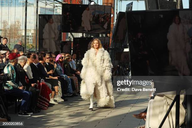 Natalia Vodianova walks the runway as guests including Camilla al-Fayed, James McCartney, Mary McCartney, Sir Paul McCartney, Sir Ringo Starr,...