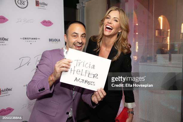 Dr. Ben Talei and Tricia Helfer pose on the red carpet for the Grand Opening Of Dr. Ben Talei's "Cupid Lips" at Cupid Lips on February 29, 2024 in...