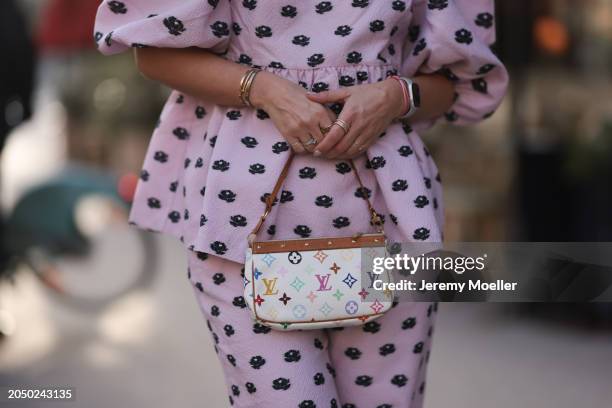 Karin Teigl seen wearing Stine Goya pink with black flower print pattern top with puffy sleeves, matching Stine Goya pink with black flower print...
