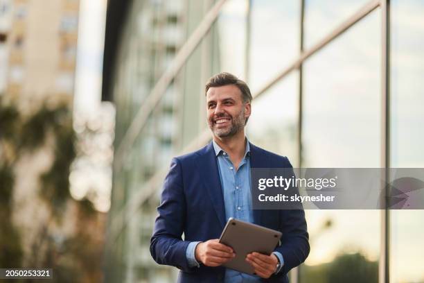 happy businessman enjoying on the city street. - zakenman stockfoto's en -beelden