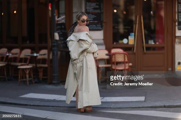 Karin Teigl seen wearing Loewe gold / brown tortoise sunglasses, Dior beige / black striped pattern silk scarf, H&M Studios beige glitter studs...