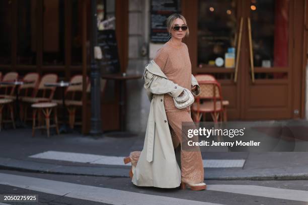 Karin Teigl seen wearing Loewe gold / brown tortoise sunglasses, Dior beige / black striped pattern silk scarf, H&M Studios beige glitter studs...