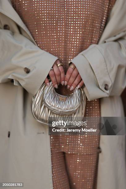 Karin Teigl seen wearingH&M Studios beige glitter studs pattern oversized t-shirt, matching H&M Studios beige glitter studs pattern long pants, H&M...