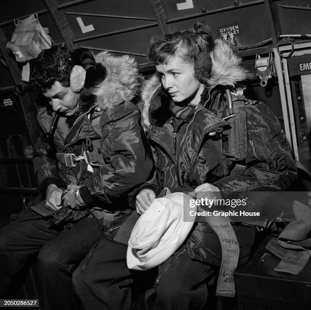 American actor and singer Eddie Fisher and his wife, American actress and singer Debbie Reynolds, both wearing fur-trimmed flight jackets, as they...