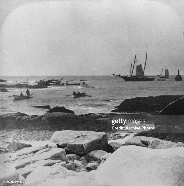 Rowboats recovering bodies and cargo following the sinking of the White Star Line transatlantic ocean liner SS Atlantic after she struck an...