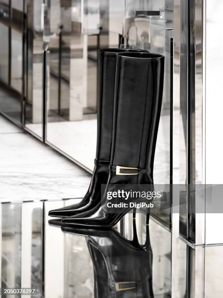 elegance in reflection - chic high-heeled boots - gold high heels stock pictures, royalty-free photos & images