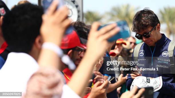 Alexander Albon of Thailand and Williams greets fans as he arrives at the circuit prior to final practice ahead of the F1 Grand Prix of Bahrain at...