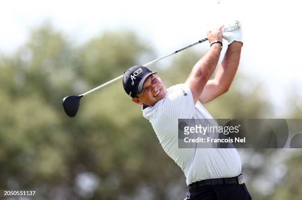 Patrick Reed of 4Aces plays a tee shot on the 9th hole during day one of the LIV Golf Invitational - Jeddah at Royal Greens Golf & Country Club on...