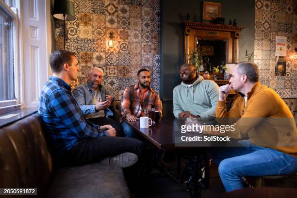 catching up with the lads - together stock pictures, royalty-free photos & images
