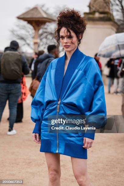 Coco Rocha wears blue Off-White jacket dress, outside Off-White, during the Womenswear Fall/Winter 2024/2025 as part of Paris Fashion Week on...