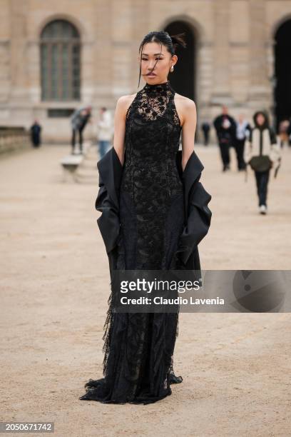 Jaime Xie wears black lace long dress, black blazer, outside Off-White, during the Womenswear Fall/Winter 2024/2025 as part of Paris Fashion Week on...