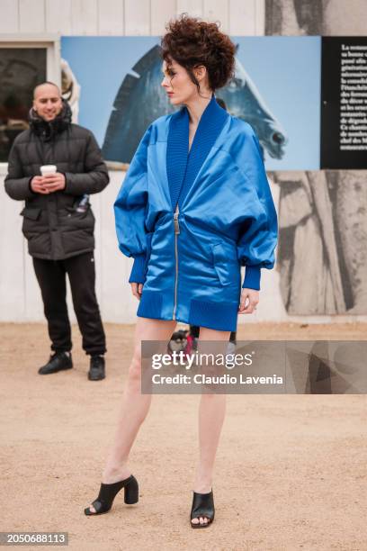 Coco Rocha wears blue Off-White jacket dress, black sandals, outside Off-White, during the Womenswear Fall/Winter 2024/2025 as part of Paris Fashion...