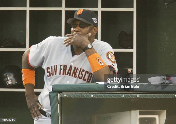 Manager Dusty Baker of the San Francisco Giants looks on from the dugout during game two of the 2002 World Series against the Anaheim Angels at...