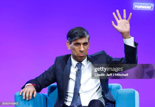 Scottish Conservative Party leader Douglas Ross with Britain's Prime Minister Rishi Sunak as he acknowledges applause following his keynote speech to...