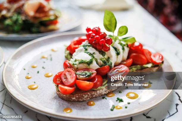 gourmet tomato mozzarella toast delight - brunch stock pictures, royalty-free photos & images