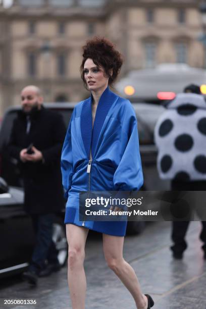 Coco Rocha is seen wearing black heels and a blue Off White one-piecer before the Off White Fashion Show during the Womenswear Fall/Winter 2024/2025...