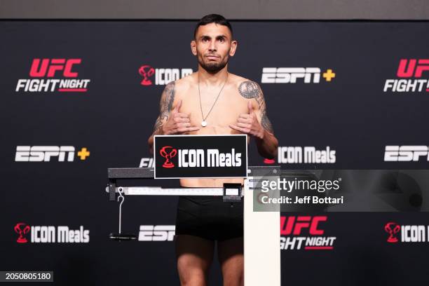 Alex Perez poses on the scale during the UFC Fight Night weigh-in at UFC APEX on March 01, 2024 in Las Vegas, Nevada.