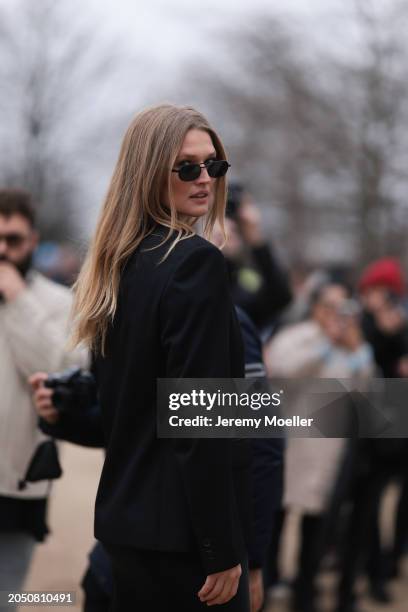 Toni Garrn is seen wearing dark shades and a black blazer before the Off White Fashion Show during the Womenswear Fall/Winter 2024/2025 as part of...