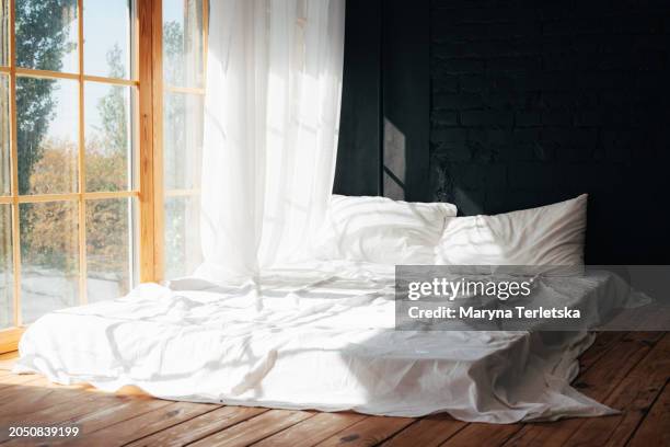 large window bed. apartment interior element. bedroom. a place to relax. - mattress stock pictures, royalty-free photos & images