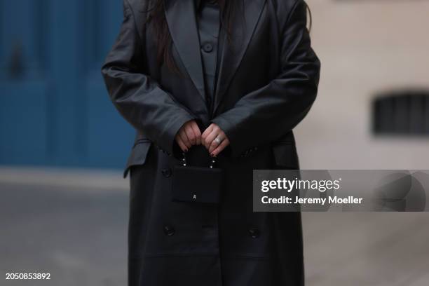 Jennifer Casimiro seen wearing Massimo Dutti black leather buttoned shirt, Ducie London black leather long coat and Amina Muaddi black leather studs...