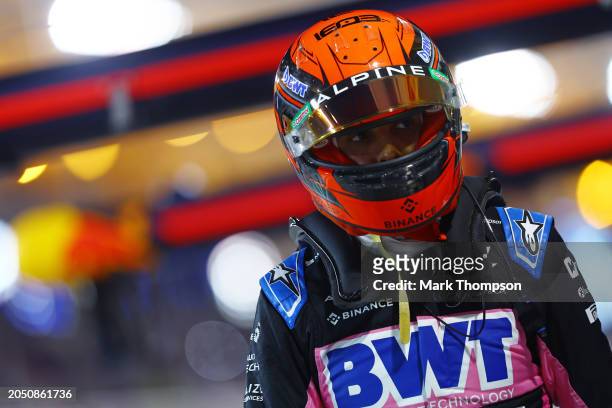 19th placed qualifier Esteban Ocon of France and Alpine F1 walks in the Pitlane during qualifying ahead of the F1 Grand Prix of Bahrain at Bahrain...