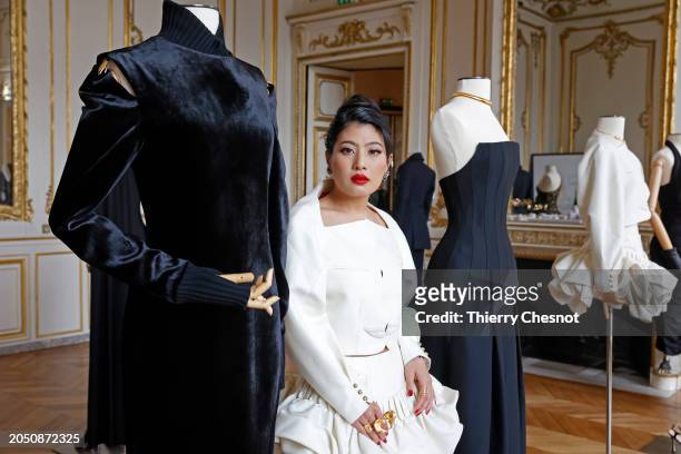 Princess Sirivannavari Nariratana Rajakanya poses next to her creations during the Sirivannavari Womenswear Fall/Winter 2024-2025 show as part of...