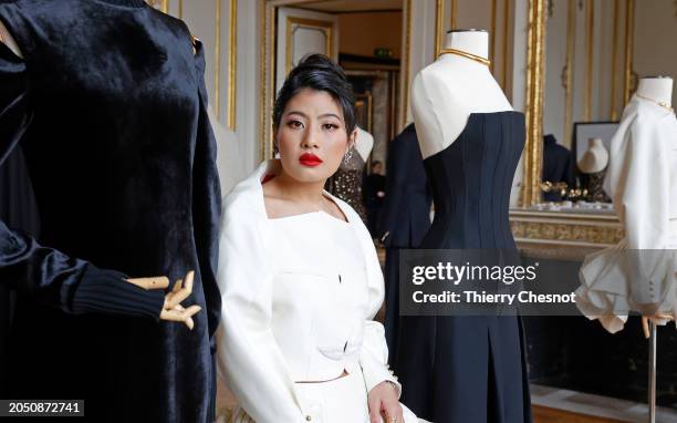 Princess Sirivannavari Nariratana Rajakanya poses next to her creations during the Sirivannavari Womenswear Fall/Winter 2024-2025 show as part of...