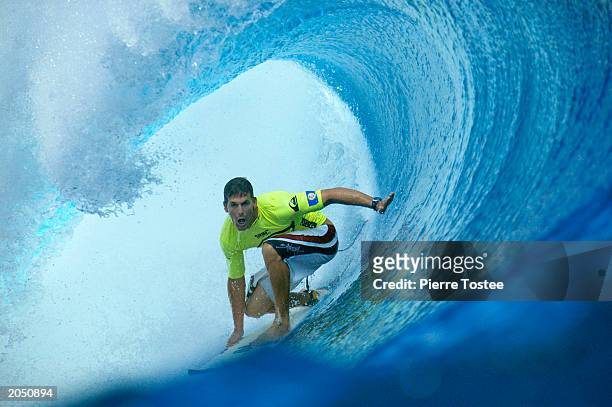 Andy Irons of Hawaii on his way to advancing to the quarter finals of the Quiksilver Pro June 2, 2003 at Cloudbreak Reef in Tavarua, Fiji.