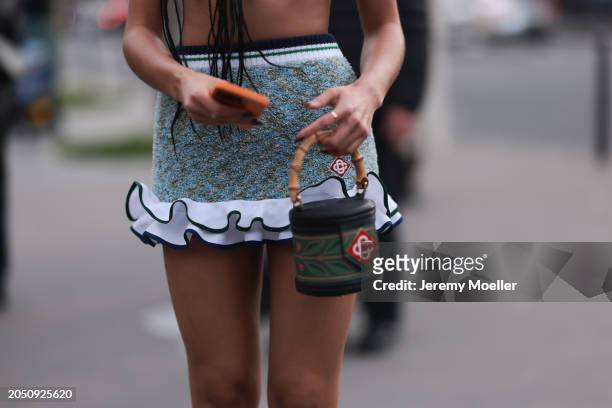 Jamilla Strand was seen wearing a green skirt with fluffy ending as well as a cropped green top along with a green casablanca bag before the...