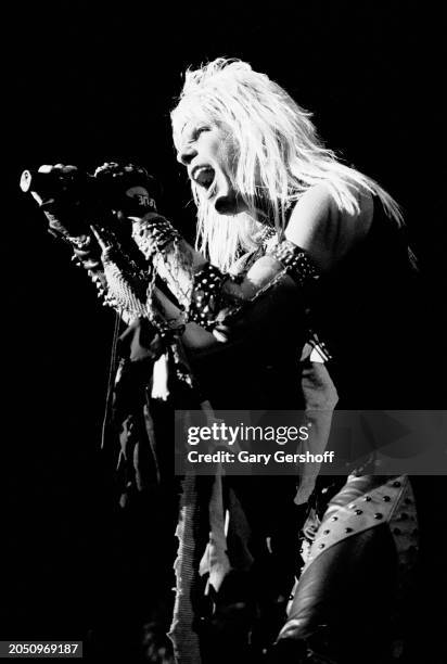 View of American Heavy Metal vocalist Vince Neil , of the group Motley Crue, as he performs onstage, during the 'Shout at the Devil' tour, at Nassau...