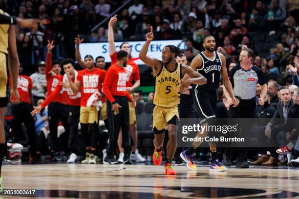 Immanuel Quickley of the Toronto Raptors reacts after a three-point basket against the Brooklyn Nets in the second half of the NBA game at Scotiabank...