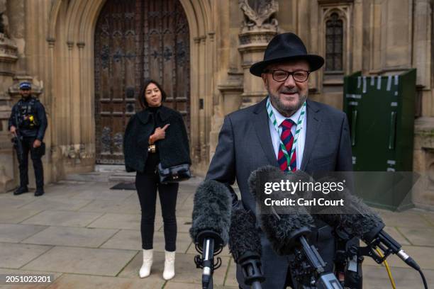 Putri Gayatri Pertiwi looks on as her husband George Galloway, the newly-elected Workers Party of Britain Member of Parliament for Rochdale, speaks...