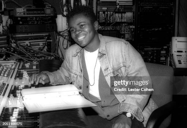 American singer-songwriter Tracy Chapman looks over music notes at a recording studio in Los Angeles, California, circa 1988.