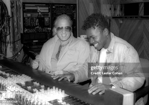 American record producer David Kershenbaum and American singer-songwriter Tracy Chapman sit in a recording studio in Los Angeles, California, circa...