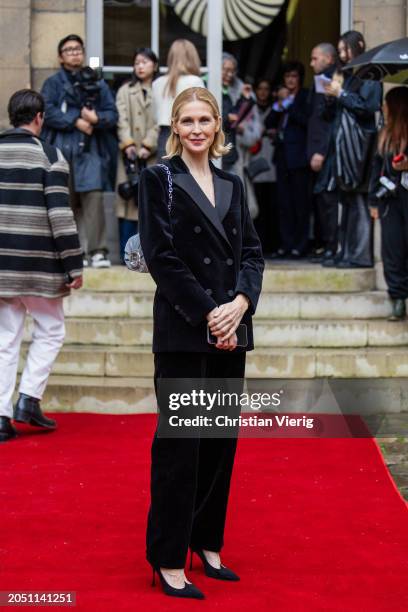 Kelly Rutherford wears black velvet suit, bag & heels Roger Vivier outside "VIVIER OP-TICAL" - Roger Vivier Presentation as part of Paris Fashion...