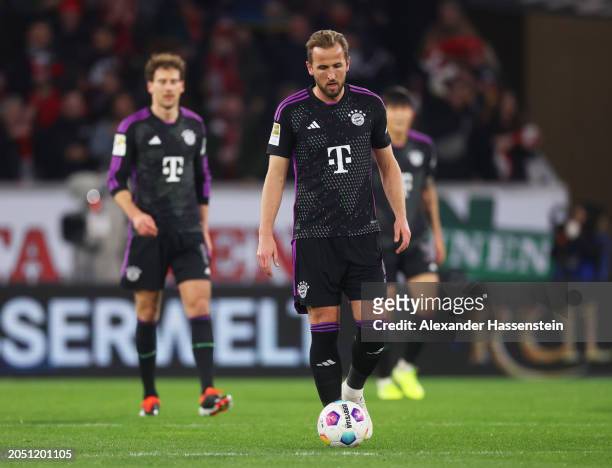 Harry Kane of Bayern Munich looks dejected after Christian Guenter of SC Freiburg scores his team's first goal during the Bundesliga match between...