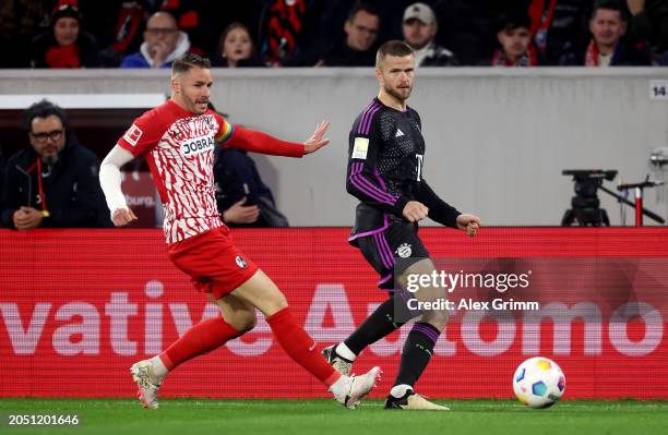 Eric Dier of Bayern Munich passes the ball whilst under pressure from Christian Guenter of SC Freiburg during the Bundesliga match between Sport-Club...