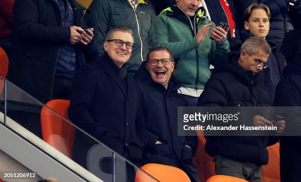 Jan-Christian Dreesen, CEO of Bayern Munich, speaks with Max Eberl, Board Member for Sport FC Bayern München, prior to the Bundesliga match between...