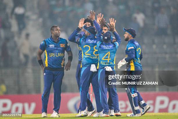 Sri Lanka's players celebrate after winning the first Twenty20 international cricket match against Bangladesh at the Sylhet International Cricket...