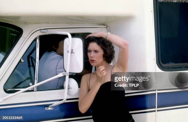 Dutch actress Sylvia Kristel looks in the mirror in New York, New York, circa 1980.