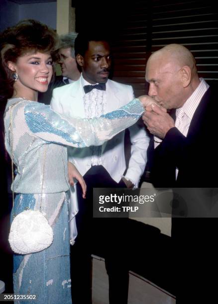 American singer and Miss America Vanessa L. Williams has her hand kissed by Russian-born actor Yul Brynner , who is co-owner of the Hard Rock Cafe as...