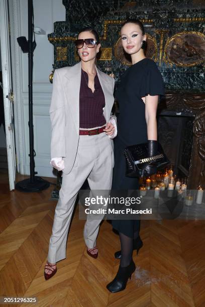 Alessandra Ambrosio and Kristina Romanova attend the Victoria Beckham Womenswear Fall/Winter 2024-2025 show as part of Paris Fashion Week on March...