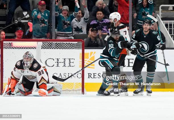 Anthony Duclair and Mike Hoffman of the San Jose Sharks celebrates after Duclair scored a goal on goalie John Gibson of the Anaheim Ducks in the...