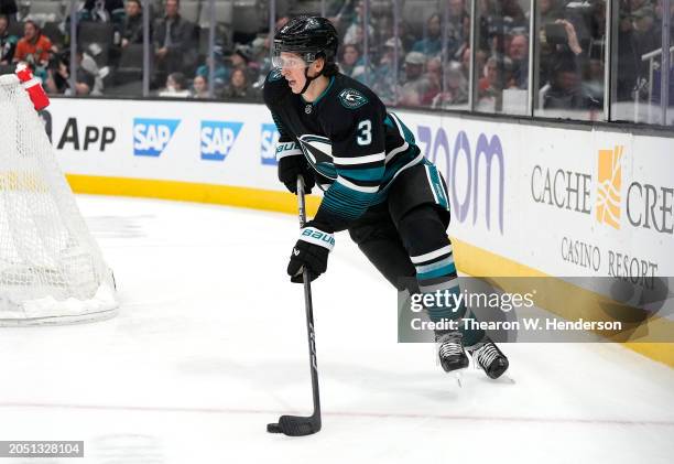 Henry Thrun of the San Jose Sharks skates from behind the net with control of the puck against the Anaheim Ducks in the third period of an NHL hockey...