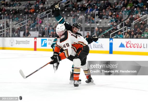 Jan Rutta of the San Jose Sharks collides with Max Jones of the Anaheim Ducks in the third period of an NHL hockey game at SAP Center on February 29,...