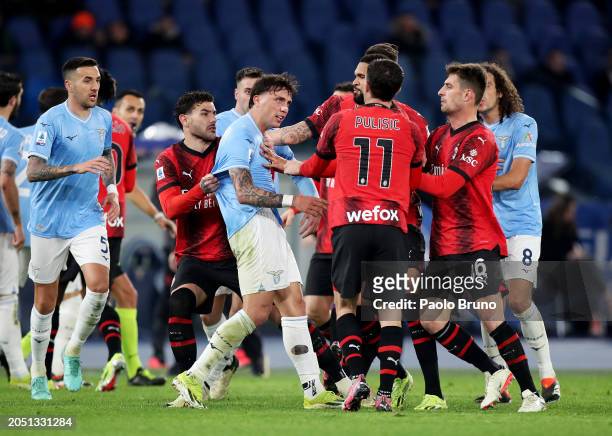 Luca Pellegrini of SS Lazio clashes with players of AC Milan during the Serie A TIM match between SS Lazio and AC Milan - Serie A TIM at Stadio...